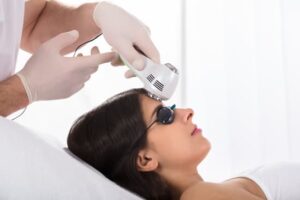 Woman Getting A Laser Treatment On Forehead